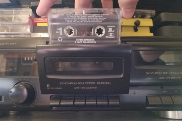 Loading a cassette tape into a cassette player